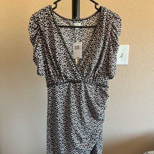 Tiny floral design. Black, white & peach petals.